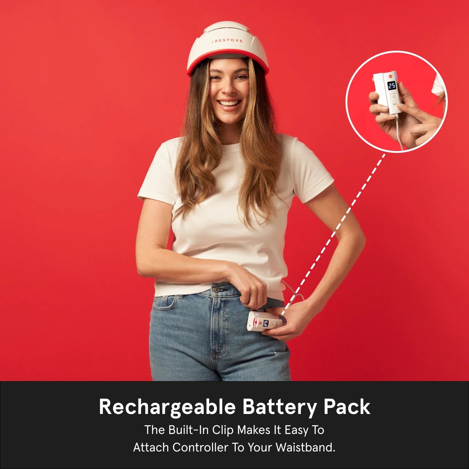 Rechargeable Battery Pack. The built-in Clip Makes it easy to attach controller to your waistband. Image shows a woman wearing the Professional helmet device while holding and clipping the rechargeable battery pack in her waistband.