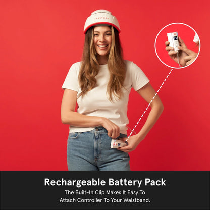 Rechargeable Battery Pack. The built-in Clip Makes it easy to attach controller to your waistband. Image shows a woman wearing the Professional helmet device while holding and clipping the rechargeable battery pack in her waistband.
