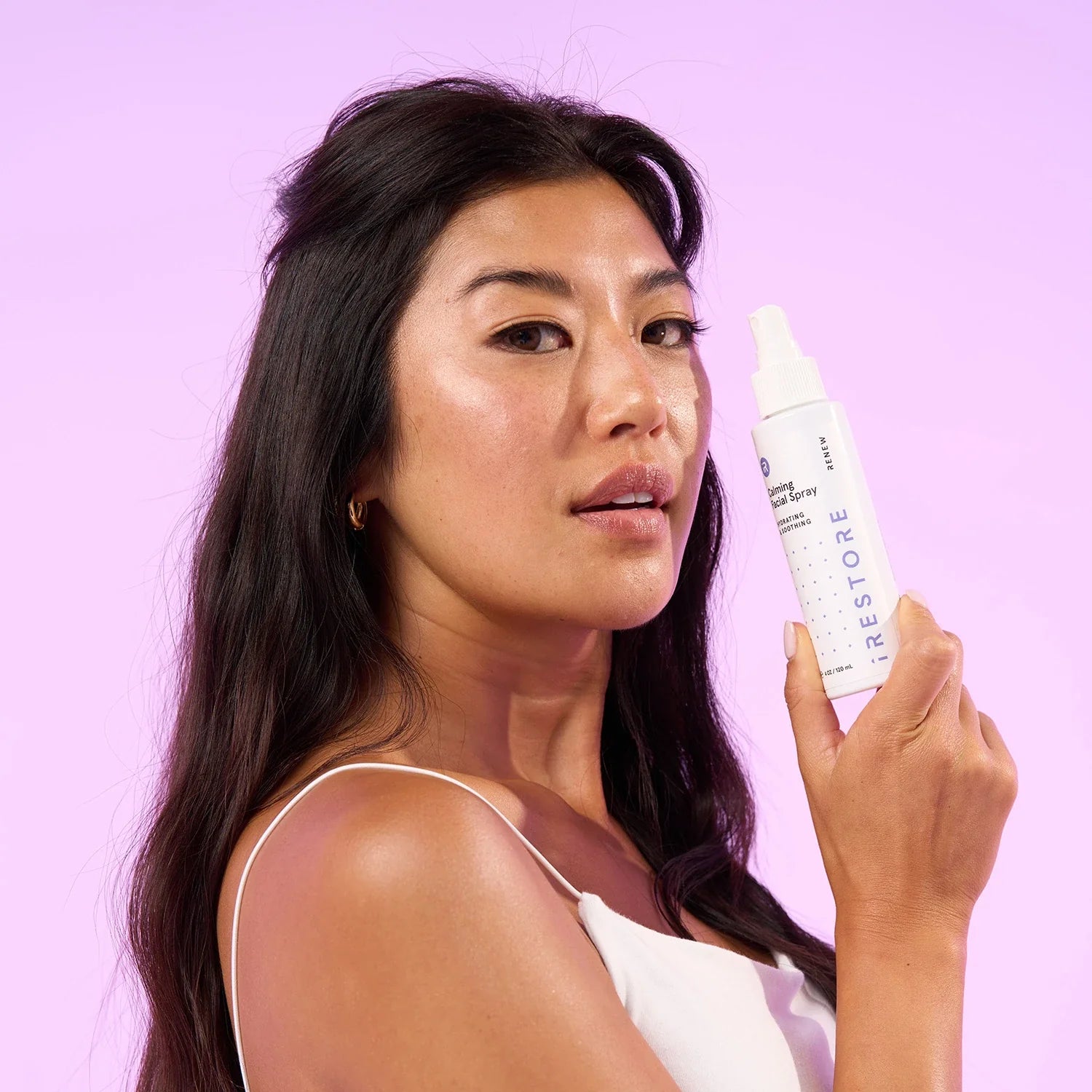 Woman holding the Calming facial spray
