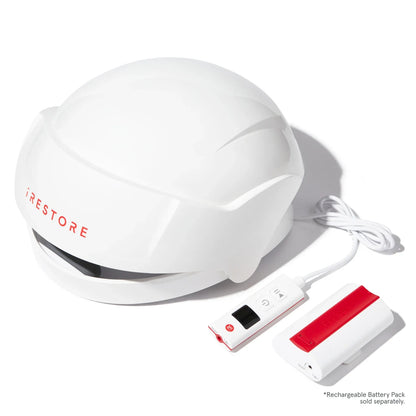 Image of the Essential helmet device beside the rechargeable battery pack.