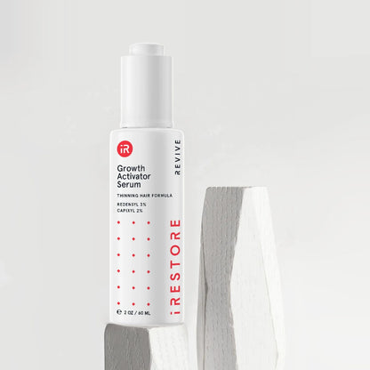 Growth activator serum on top of white wood