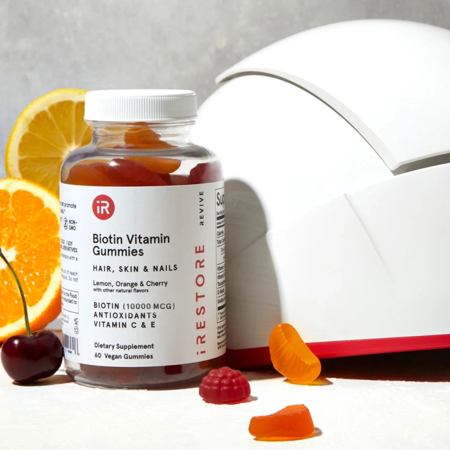 Biotin vitamin gummies with irestore professional device behind it.