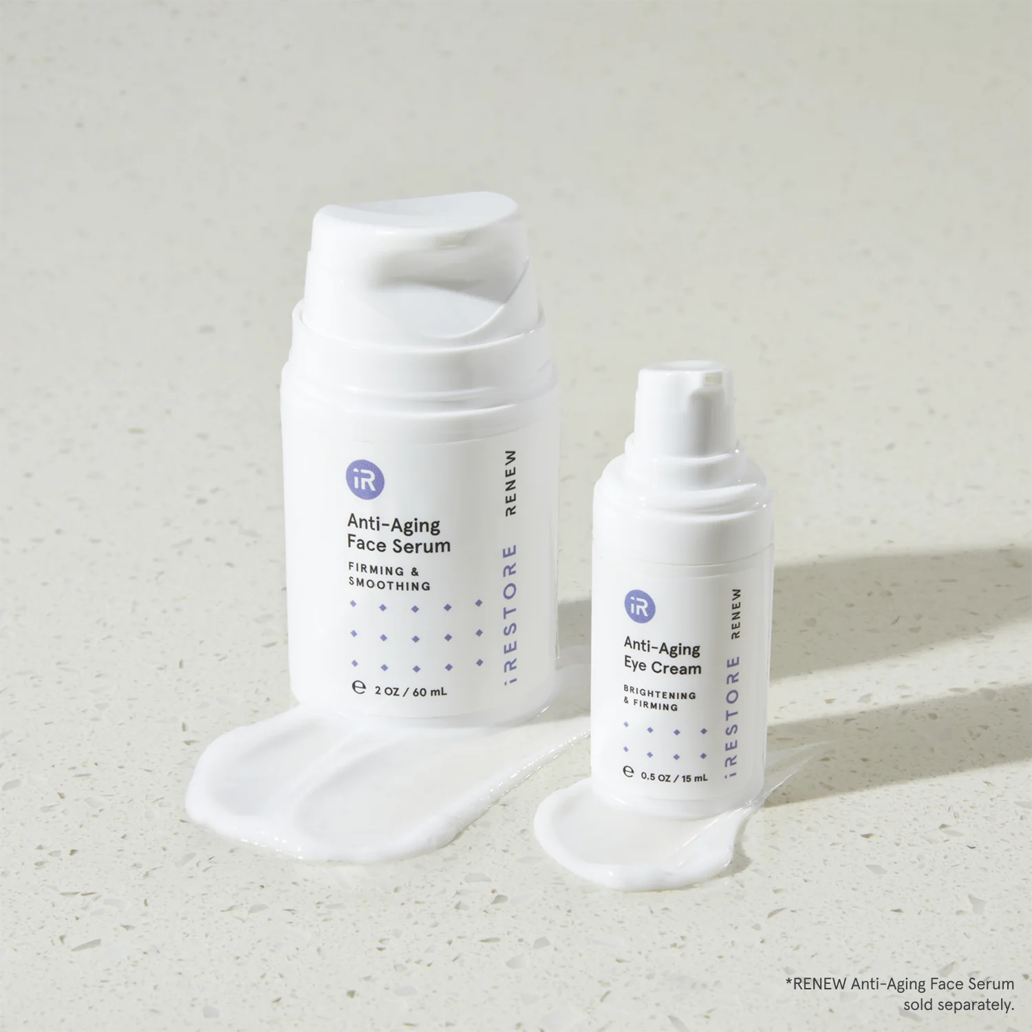 Anti-aging face serum and anti-aging eye cream beside each other