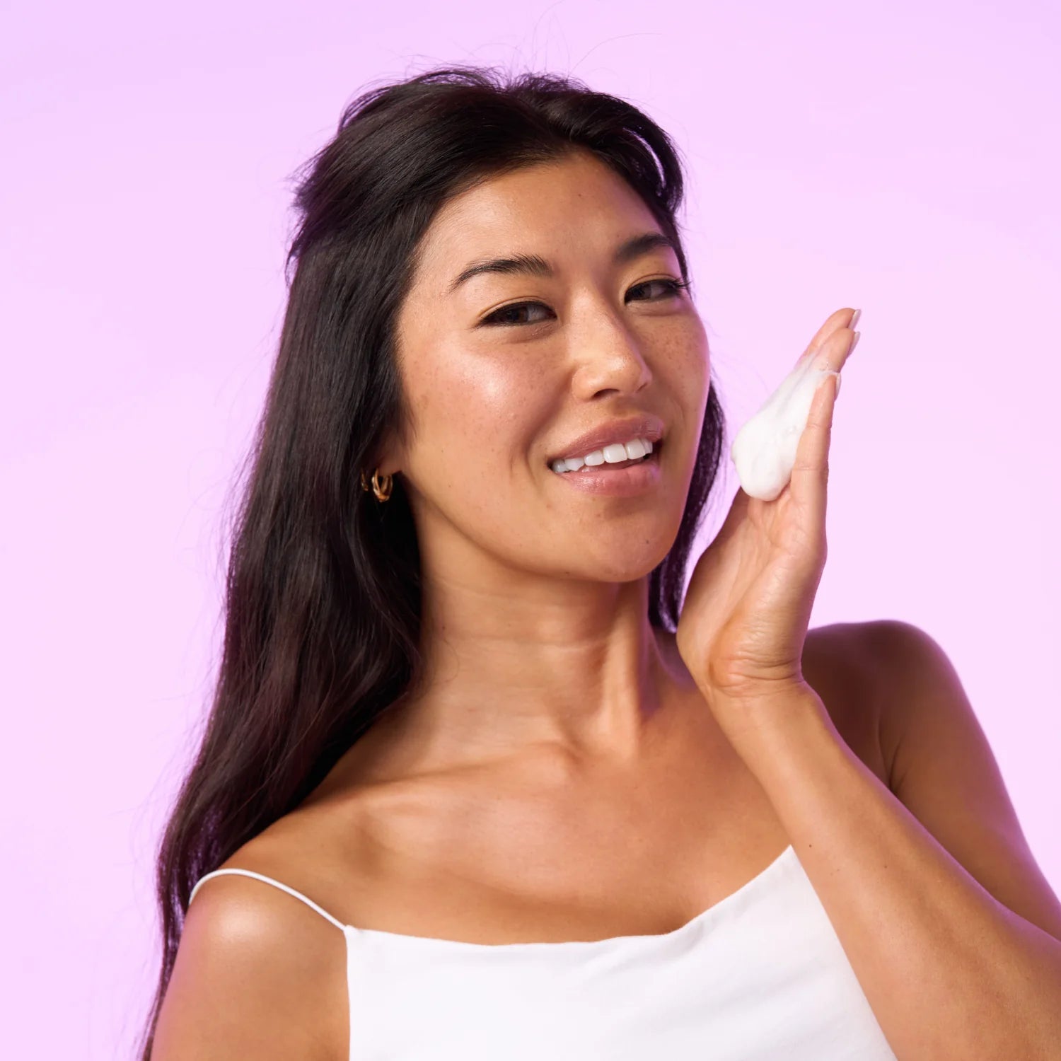 Woman with foam on her left hand